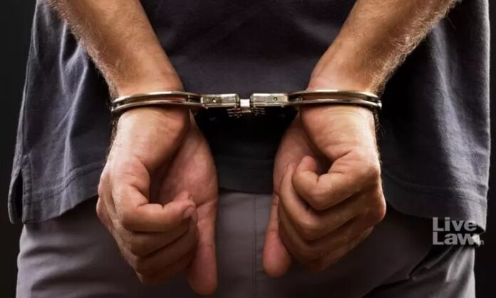 618027-arrest-handcuffed-1.jpg